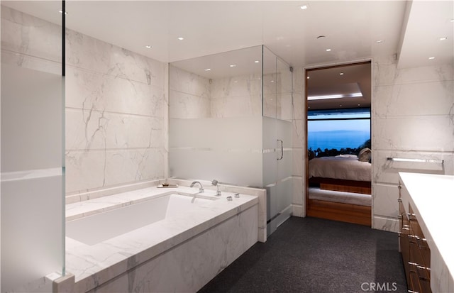 2526 Riviera Dr, Laguna Beach, CA 92651 - full bath with tile walls, a garden tub, connected bathroom, and vanity