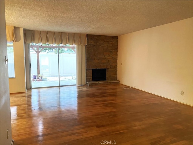 1740 Silver Maple Dr, La Habra, CA 90631 - unfurnished living room with a textured ceiling, wood finished floors, and a fireplace