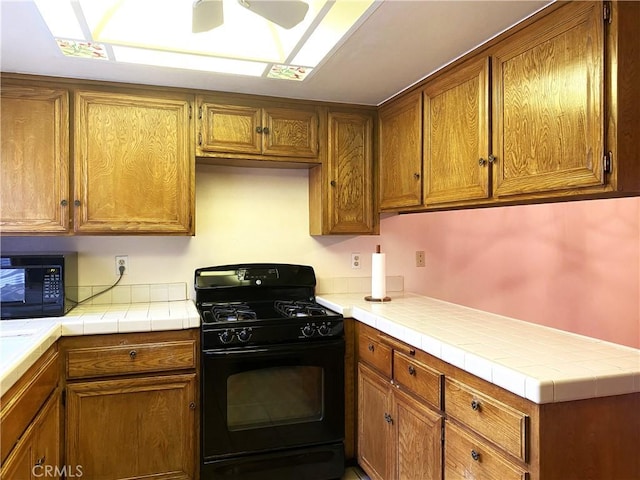 1740 Silver Maple Dr, La Habra, CA 90631 - kitchen featuring black appliances, brown cabinets, and ceiling fan