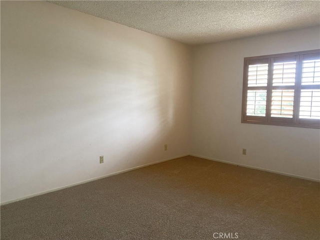 1740 Silver Maple Dr, La Habra, CA 90631 - carpeted empty room with a textured ceiling and baseboards