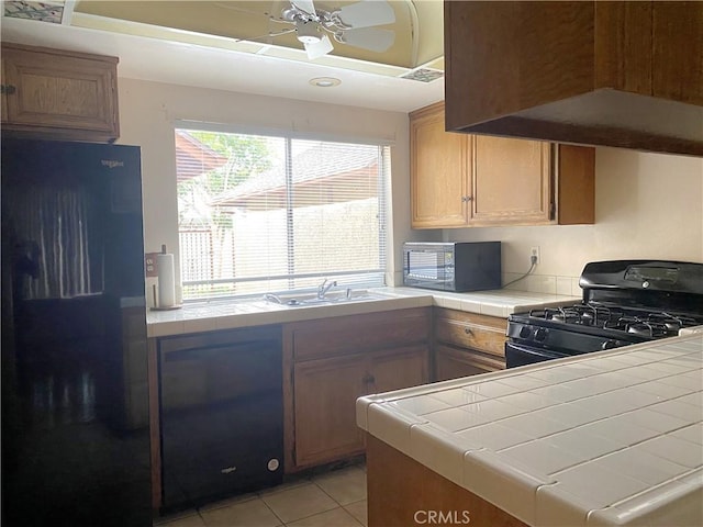 1740 Silver Maple Dr, La Habra, CA 90631 - kitchen with black appliances, tile countertops, ceiling fan, a sink, and light tile patterned floors