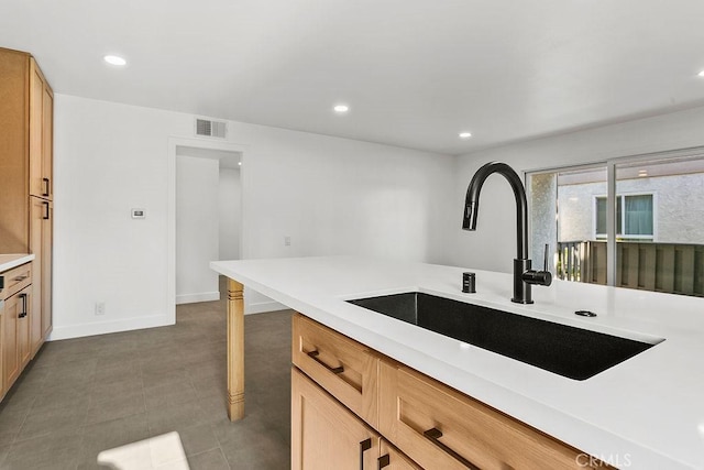 2835 S Fairview St Unit C, Santa Ana, CA 92704 - kitchen featuring a sink, light countertops, recessed lighting, and baseboards