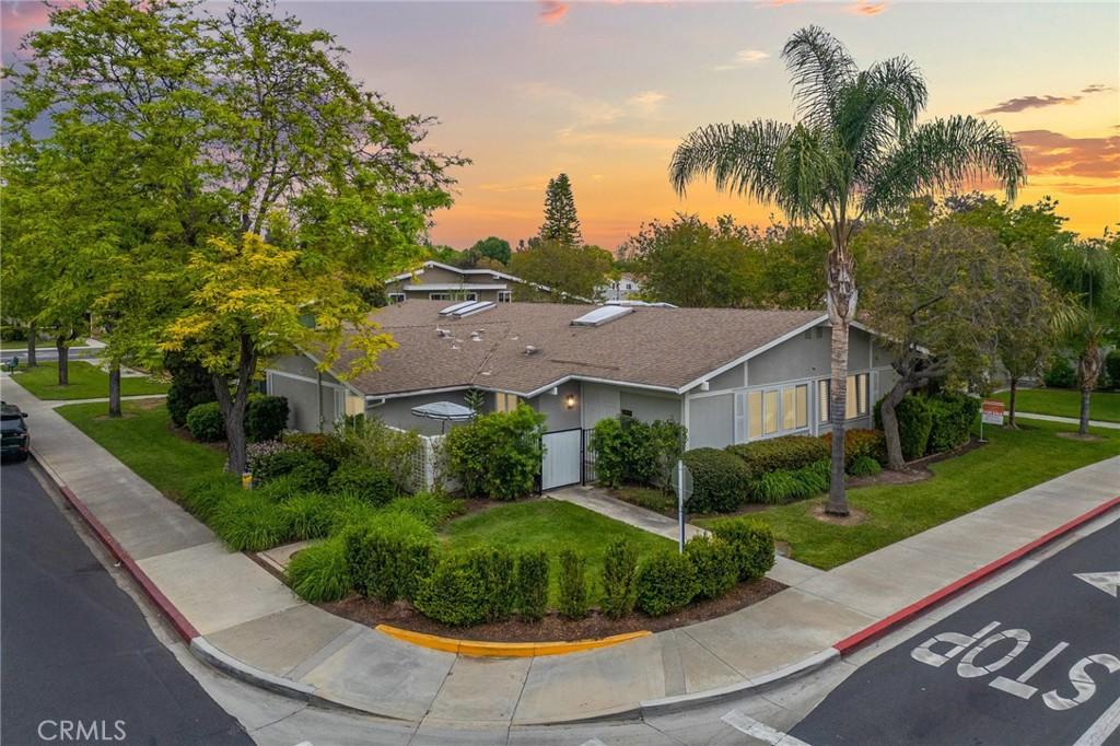 705 Avenida Sevilla Unit D, Laguna Woods, CA 92637 - view of front of house with a front lawn