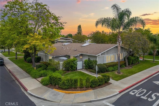 705 Avenida Sevilla Unit D, Laguna Woods, CA 92637 - view of front of house with a front lawn