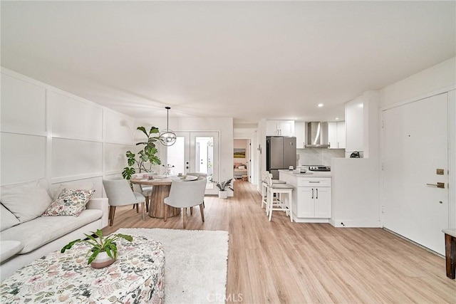 3004 Via Buena Vis Unit C, Laguna Woods, CA 92637 - living room featuring light wood-style flooring and french doors