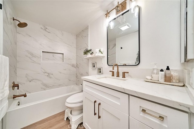 3004 Via Buena Vis Unit C, Laguna Woods, CA 92637 - bathroom featuring toilet, vanity, shower / tub combination, and wood finished floors