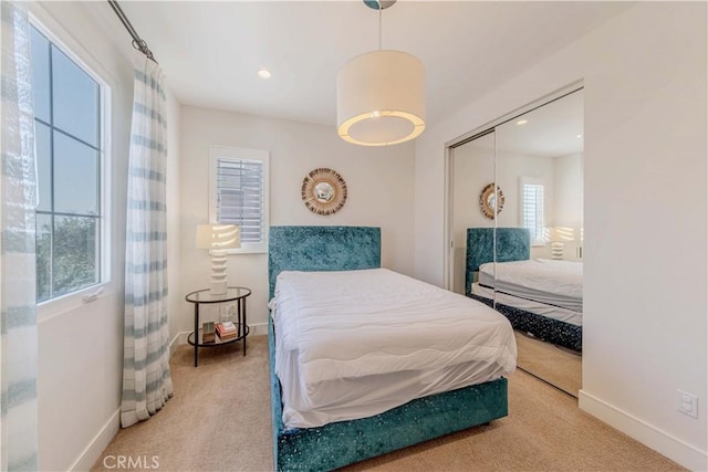 bedroom with carpet floors, baseboards, a closet, and recessed lighting