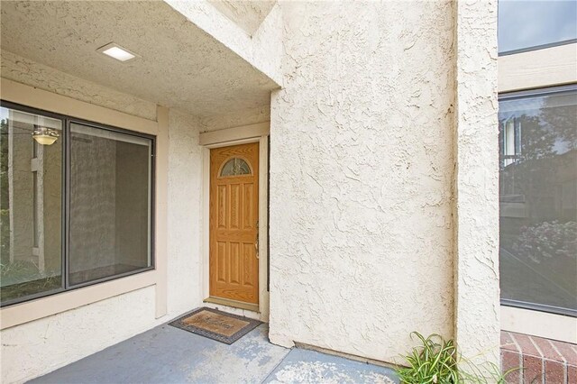 611 Colonial Cir, Fullerton, CA 92835 - view of exterior entry featuring stucco siding