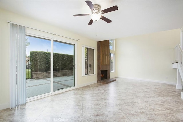 611 Colonial Cir, Fullerton, CA 92835 - unfurnished living room featuring a fireplace, ceiling fan, and baseboards