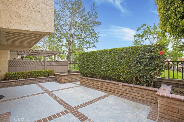 611 Colonial Cir, Fullerton, CA 92835 - view of patio featuring a pergola and a fenced backyard