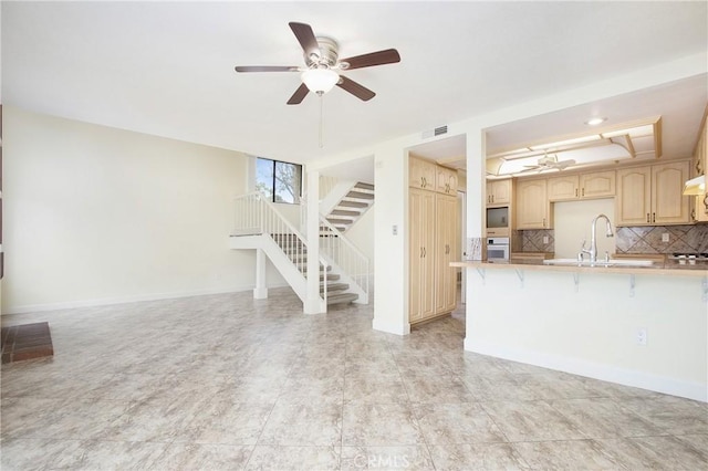 611 Colonial Cir, Fullerton, CA 92835 - unfurnished living room featuring a sink, stairs, and a ceiling fan
