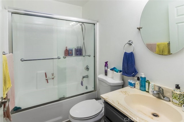 full bathroom with toilet, combined bath / shower with glass door, and vanity