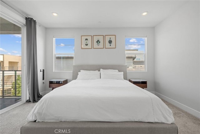 carpeted bedroom with access to exterior, multiple windows, baseboards, and recessed lighting