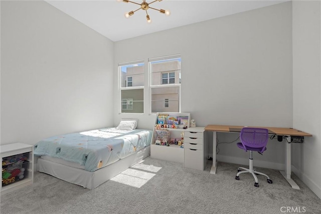 carpeted bedroom with a chandelier