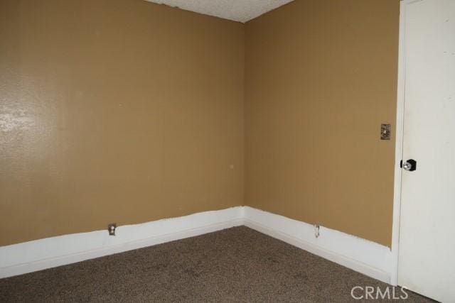 819 Sherwood Way, Willows, CA 95988 - empty room with carpet floors and baseboards
