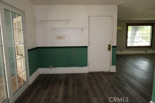 819 Sherwood Way, Willows, CA 95988 - unfurnished room with wood finished floors, baseboards, and a wainscoted wall