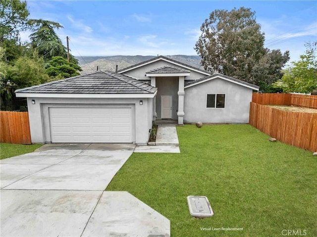 230 E Hoffer St, Banning, CA 92220 - single story home with a garage, stucco siding, driveway, and a mountain view