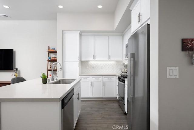 204 Alienta Ln, Rancho Mission Viejo, CA 92694 - kitchen featuring appliances with stainless steel finishes, dark wood-style floors, recessed lighting, light countertops, and tasteful backsplash
