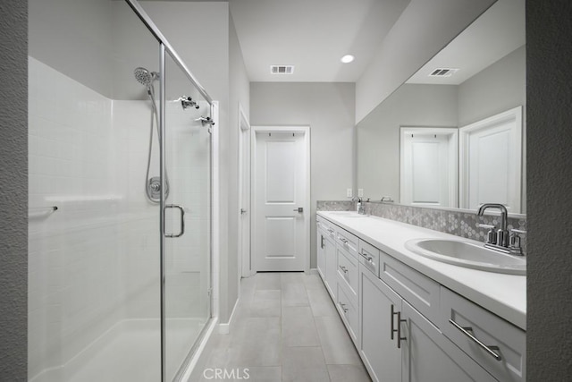 204 Alienta Ln, Rancho Mission Viejo, CA 92694 - bathroom with a shower stall, double vanity, and tile patterned flooring