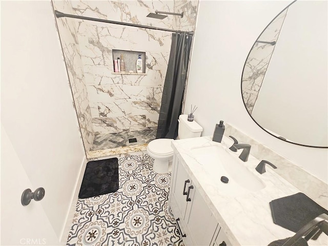 full bath featuring toilet, a shower stall, and vanity
