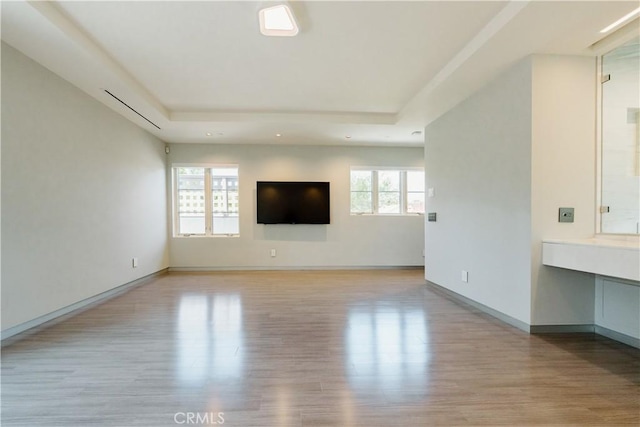 1873 S Los Robles Ave, San Marino, CA 91108 - unfurnished living room with light wood-style flooring, recessed lighting, baseboards, and a tray ceiling