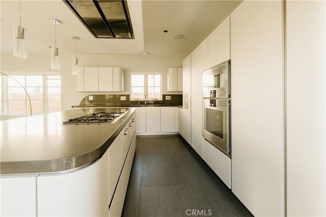 1873 S Los Robles Ave, San Marino, CA 91108 - kitchen with appliances with stainless steel finishes, white cabinetry, pendant lighting, and a sink
