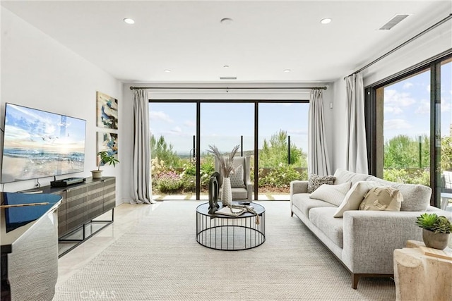 living room with plenty of natural light and recessed lighting