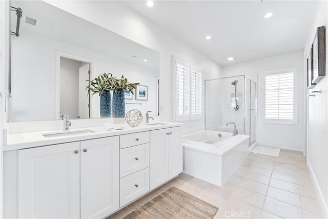 bathroom featuring plenty of natural light, a stall shower, tile patterned floors, recessed lighting, and a garden tub