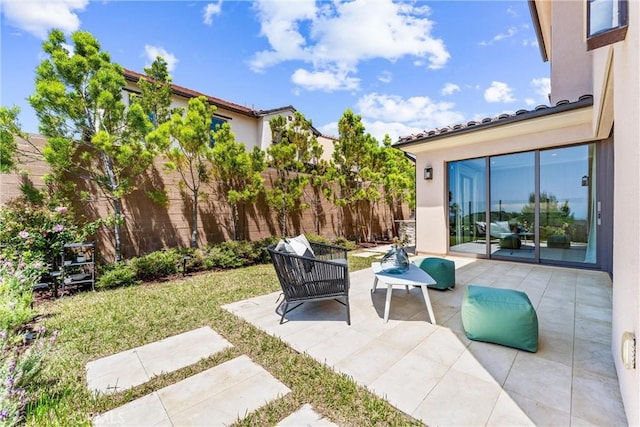 view of patio / terrace featuring fence