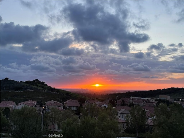 view of mountain background with nearby suburban area