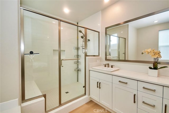 259 Chorus, Irvine, CA 92618 - full bath featuring a stall shower, vanity, recessed lighting, and wood finished floors