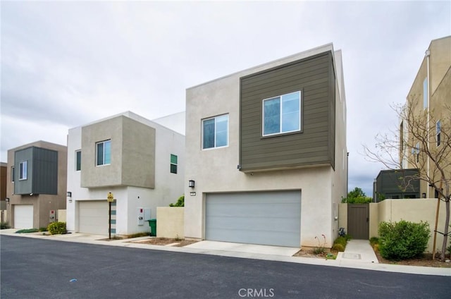 259 Chorus, Irvine, CA 92618 - contemporary house with an attached garage, stucco siding, and a gate