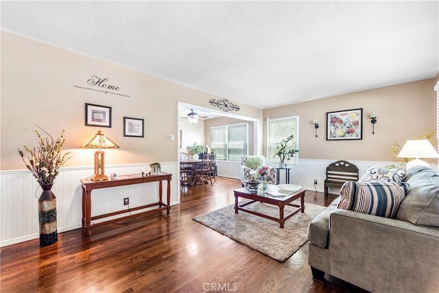 4702 Castana Ave, Lakewood, CA 90712 - living area with a wainscoted wall, wood finished floors, ceiling fan, and a textured ceiling
