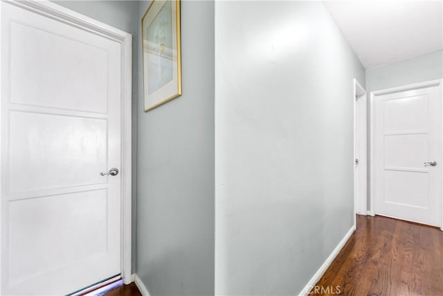 4702 Castana Ave, Lakewood, CA 90712 - corridor with dark wood-style floors and baseboards