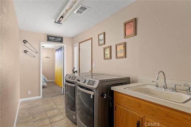 6176 Some Way, Magalia, CA 95954 - laundry room with washer and dryer, a textured wall, and baseboards