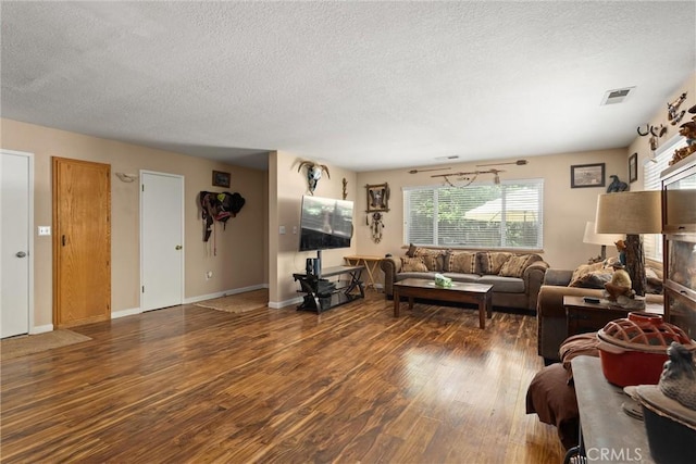 6176 Some Way, Magalia, CA 95954 - living room featuring a textured ceiling, wood finished floors, and baseboards