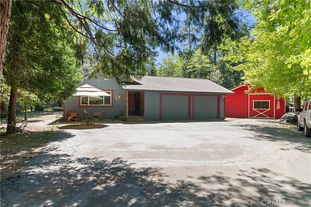 6176 Some Way, Magalia, CA 95954 - view of front facade featuring driveway, an attached garage, and a barn