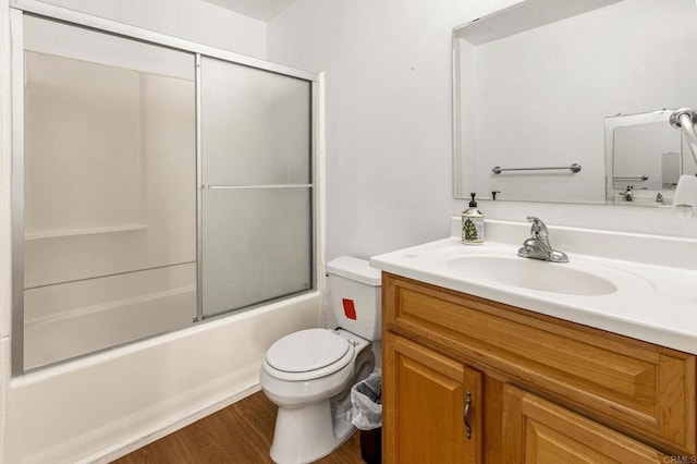 252 Worthington St, Spring Valley, CA 91977 - full bathroom featuring toilet, wood finished floors, vanity, and enclosed tub / shower combo