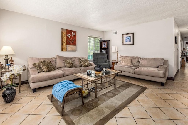 252 Worthington St, Spring Valley, CA 91977 - living room featuring light tile patterned floors and a textured ceiling