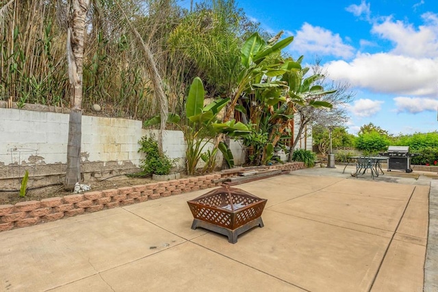 252 Worthington St, Spring Valley, CA 91977 - view of patio with a fire pit, a grill, fence, and outdoor dining area