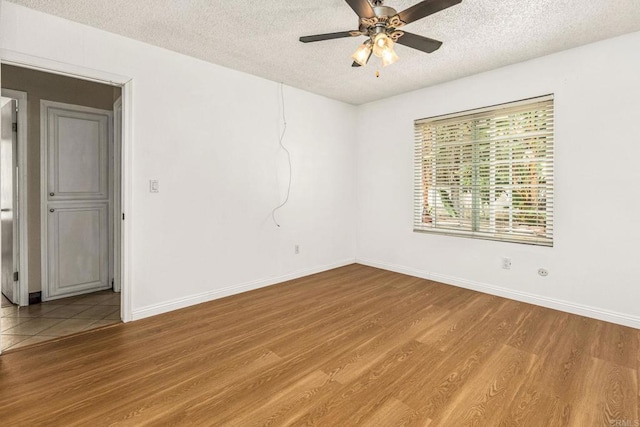 252 Worthington St, Spring Valley, CA 91977 - unfurnished room featuring a textured ceiling, light wood-style floors, ceiling fan, and baseboards