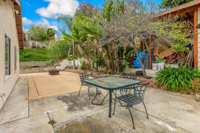 252 Worthington St, Spring Valley, CA 91977 - view of patio featuring a fire pit and outdoor dining space