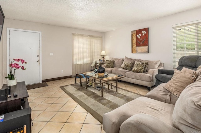 252 Worthington St, Spring Valley, CA 91977 - living area with light tile patterned floors, a textured ceiling, and baseboards