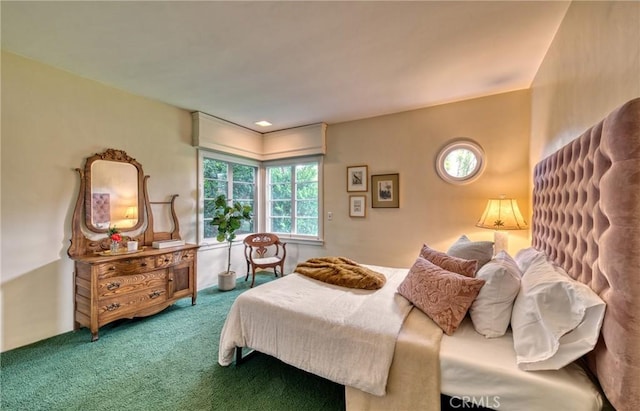 bedroom with carpet flooring and multiple windows