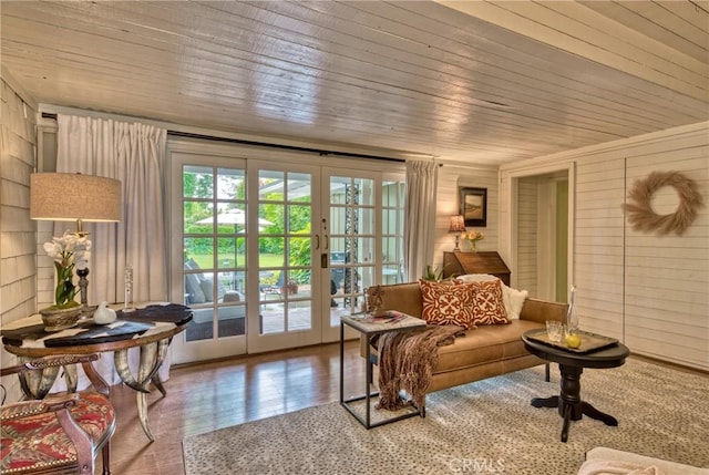 sunroom / solarium featuring french doors