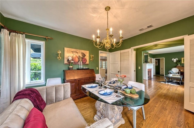 dining room featuring a chandelier and wood finished floors
