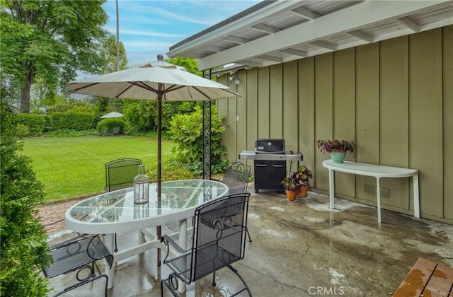 view of patio featuring area for grilling and outdoor dining space