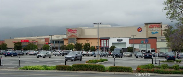 view of commercial property featuring uncovered parking