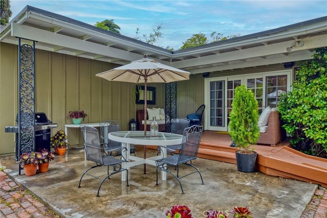 view of patio / terrace featuring a deck and outdoor dining area