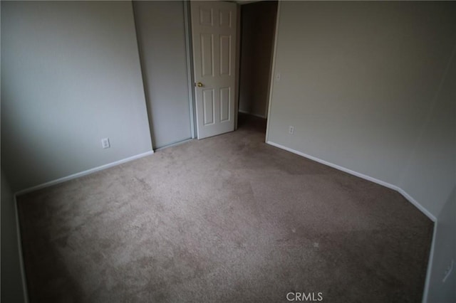 1680 Elmbridge Ln, Hemet, CA 92545 - unfurnished bedroom with carpet floors and baseboards
